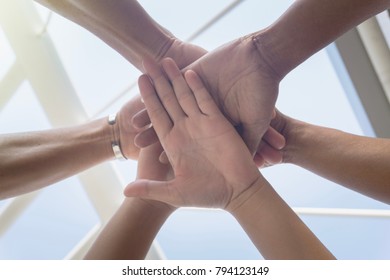 Close up from bottom view, circle stack of hands between friends or partnerships together, achievement with support teamwork concept