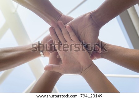 Close up from bottom view, circle stack of hands between friends or partnerships together, achievement with support teamwork concept
