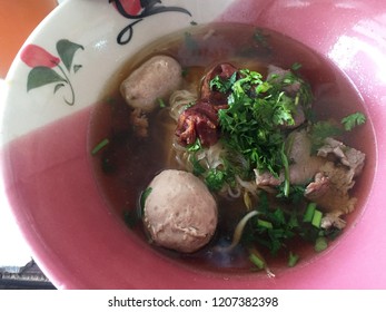 Close up bowl of Thai style Beef noodle soup with meatball - Powered by Shutterstock