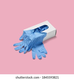 Close Up Of A Box Of White Latex Protective Gloves On White Background