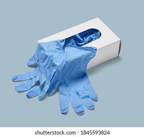 Close Up Of A Box Of White Latex Protective Gloves On White Background