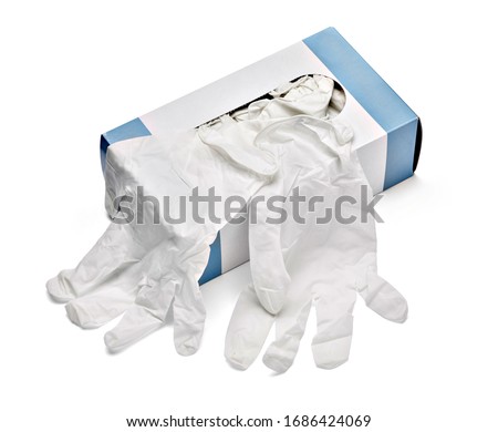 close up of a box of white latex protective gloves on white background