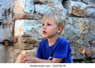 A close up of a boy looking at something