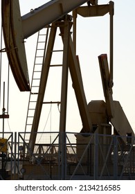 Close Up Of BPU Crude Oil Pump Beam At The Oilfield At Sunset - Selective Focus