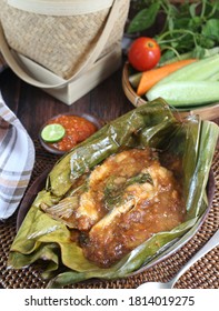 Close Up Of Brengkes Patin Tempoyak Or Pangasius Fish Which Is Seasoned And Mixed With Fermented Durian, Then Wrapped In Banana Leaves And Steamed.  Typical Food Of Palembang, Indonesia.