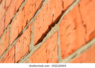 Close Brick Wall With Mortar Joints On The Background