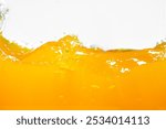 Close up bright orange juice splash texture for health and nature waves, Beautiful waves curve and little bubbles smooth for garphic design and background