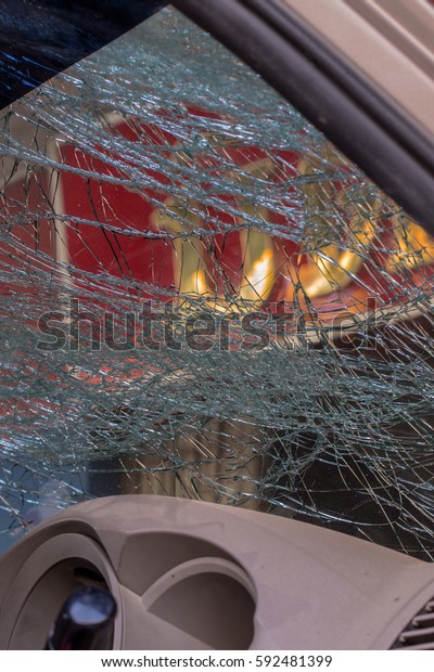 Close\
Up of a Broken Car Windshield from inside the\
car