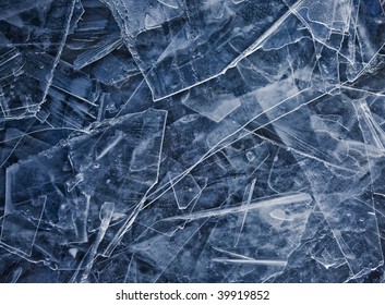 Close Up Of Broken Ice As Abstact Winter Background. Blue Tone.