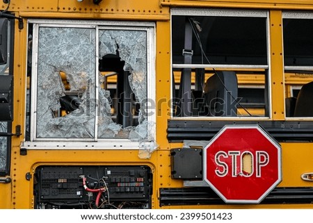 close up of broken school bus windows 