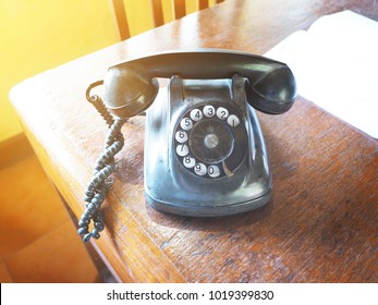 Close Up Broken Vintage Dial Telephone On Wooden Brown Table, Vintage Filter Effect