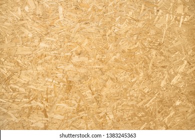 Close up of brown chipboard. Chipboard background. - Shutterstock ID 1383245363