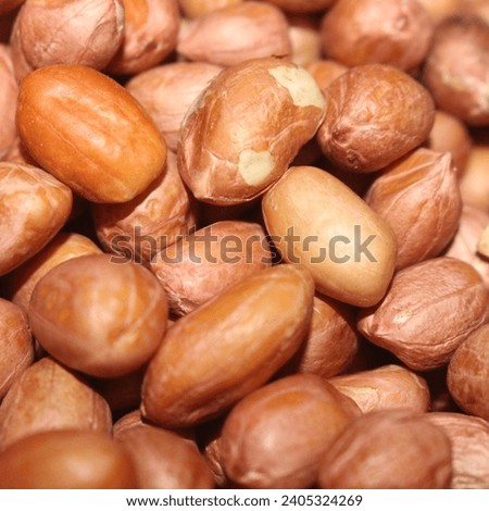 close up brown peanuts in bulk