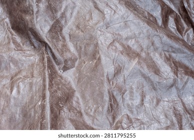 Close up of a brown plastic tarp texture background