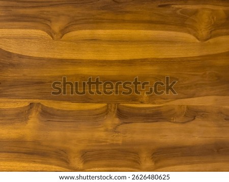 Close up of brown teak solid wood texture with exposed dark veins. seamless timber wooden background texture