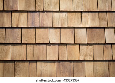 Close up of brown wood roof shingles.