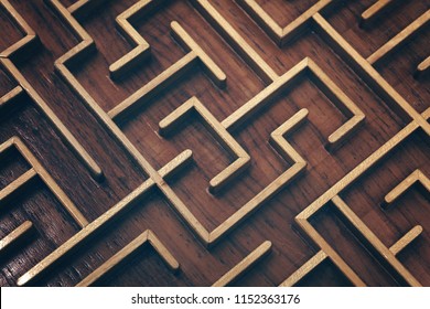 Close up of brown wooden labyrinth maze, toy puzzle game, elevated high angle view