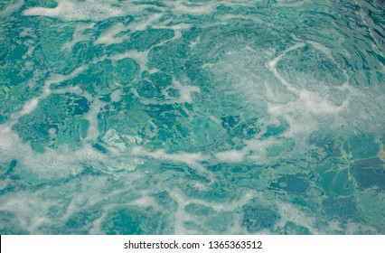 Close Up Bubbles Of Water In Jacuzzi. Spa Massage Background.