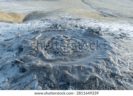 Close up of bubbling active mud volcano in geothermal area