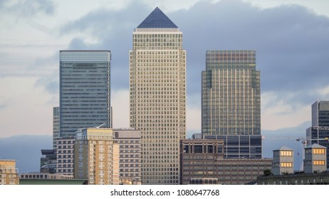 Close Up Of Buildings In Canary Wharf In London With Clouds In The Background