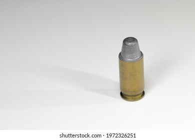 close up bullet 11 mm or .45 acp LSWC ( Lead Semi wadcutter ) ready for use, isolate on white background reflection surface.

