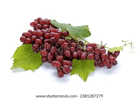 Close up of a bunch of Red Globe grape with fruits and leaves onwhite floor, South Korea

