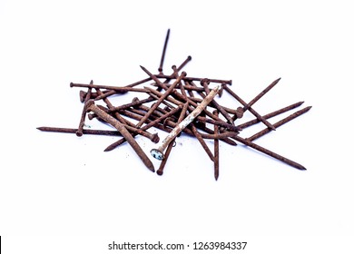 Close up of bunch of rusted nails isolated on white.