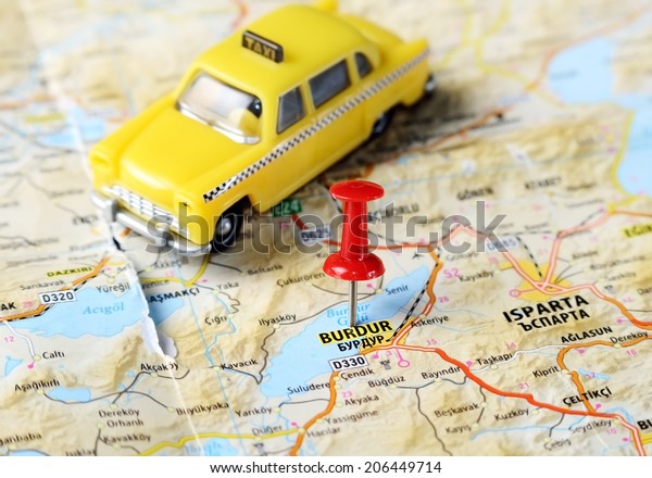 Close up of  Burdur  ,Turkey  map with red pin\
and a taxi   - Travel\
concept