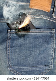 Close up of burning phone in jeans back pocket. 