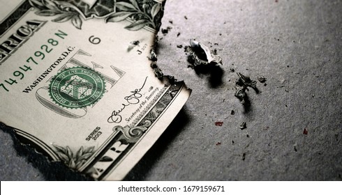Close up of burnt dollar notes