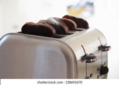 Close Up Of Burnt Toast In Toaster