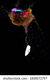 Close Up Of Burst Water Balloon On Black Background