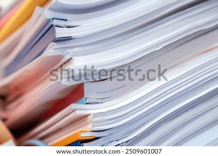 Close up of business documents stack on desk , report papers stackColorful business documents are placed in a filing cabinet in the office.
