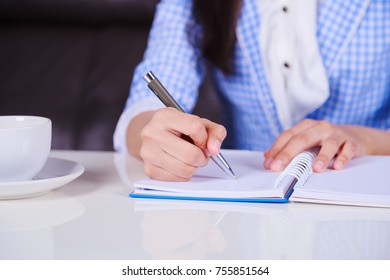 Close Up Of Business Hand Writing On Notebook