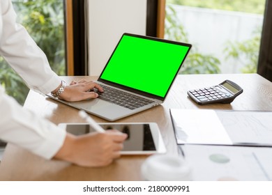 Close Up Business Hands Typing On Laptop Keyboard With Green Screen.