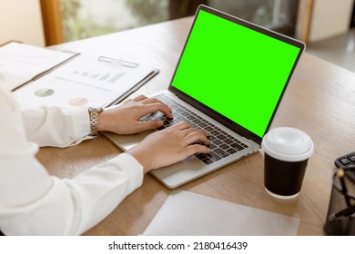 Close Up Business Hands Typing On Laptop Keyboard With Green Screen.