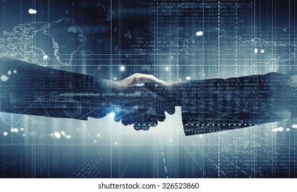 Close Up Of Business Handshake On Digital Background