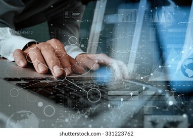 Close Up Of Business Man Hand Working On Blank Screen Laptop Computer On Wooden Desk As Concept