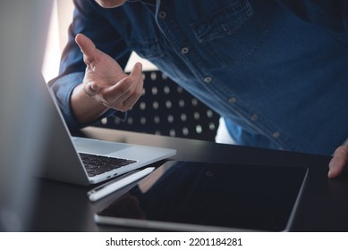 Close Up Of Business Man Having A Discussion, Video Conference Using Online Meeting App Via Laptop Computer At Home Office, Remotely Work, Working At Home, Telecommuting, Web Conference Concept