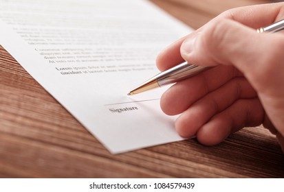 Close up business man signing contract making a deal - Shutterstock ID 1084579439