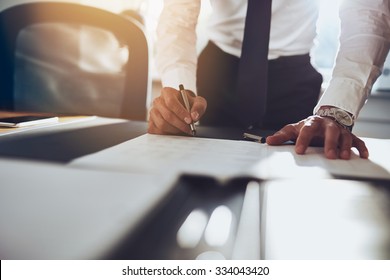 Close up business man signing contract making a deal, classic business - Shutterstock ID 334043420