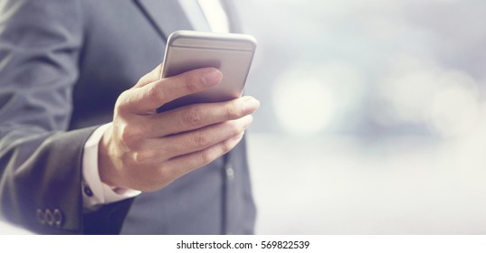 Close Up Of A Business Man Using Mobile Smart Phone, Copy Space.