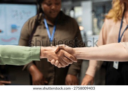 Close up of business managers doing handshake and welcoming each other, successful partnership to ensure objectives achievement and a global enterprise development. Productivity.