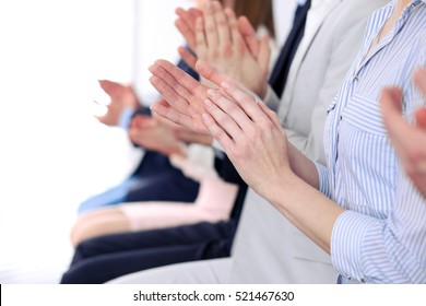 Close Up Of Business People Hands  Clapping At Conference