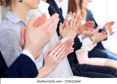 Close Up Of Business People Hands  Clapping At Conference