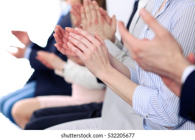 Close Up Of Business People Hands  Clapping At Conference