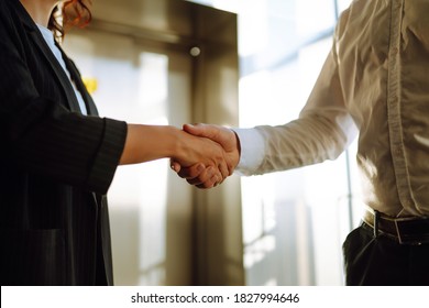 Close Up Of Business People Shaking Hands After Contract Meeting At Customer Office. Business Etiquette, Congratulation, Merger And Acquisition Concepts.