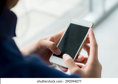 Close Up Of Business Woman Handing Smartphone.