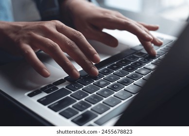 Close up of business woman hands typing on laptop computer and digital tablet, searching and surfing the internet on office desk, online working, telecommuting, freelancer at work concept