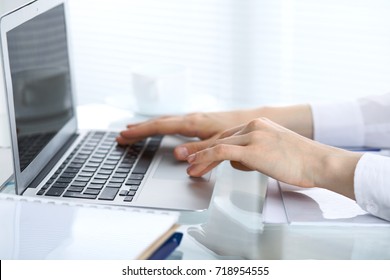Close Up Of Business Woman Hands Typing On Laptop Computer